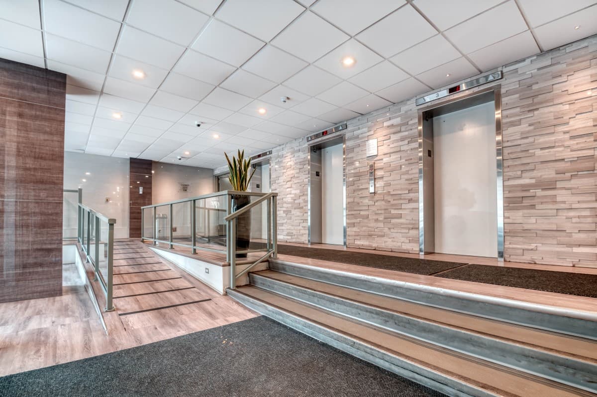 https://www.capreit.ca/wp-content/uploads/2021/09/20929-Garneau-Towers-Wheelchair-Accessible-Lobby-Elevators-resized-for-web.jpg