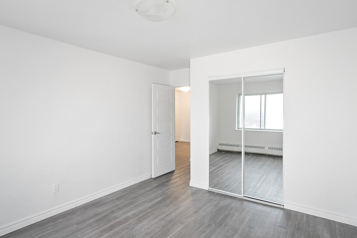 https://www.capreit.ca/wp-content/uploads/2021/09/4-benny-crescent-montreal-qc-bedroom.jpg