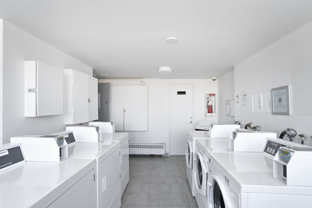 https://www.capreit.ca/wp-content/uploads/2021/09/9-bois-de-boulogne-montreal-QC-laundry-room.jpg